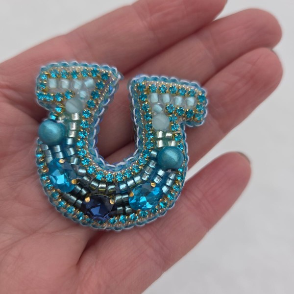 Piespraude Mazais zelta laimes pakavs