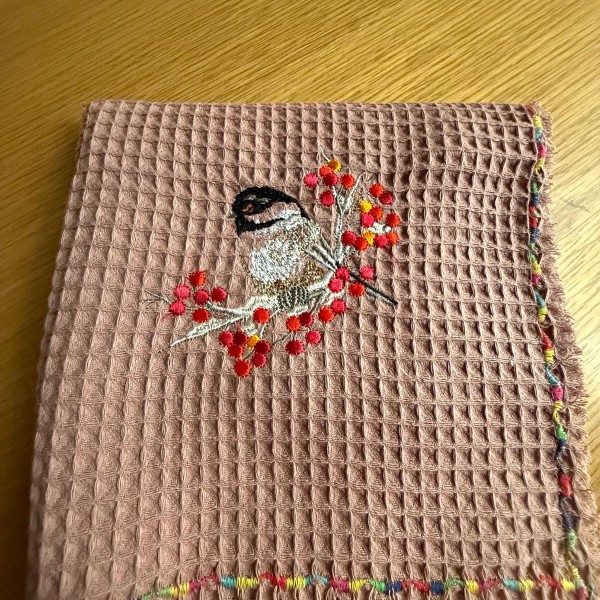 Izšūts virtuves dvielis