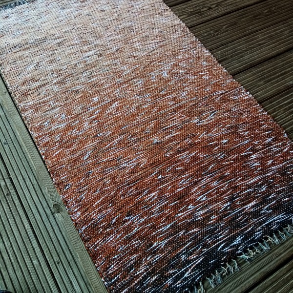 Brūnu / bēšu toņu paklājiņš